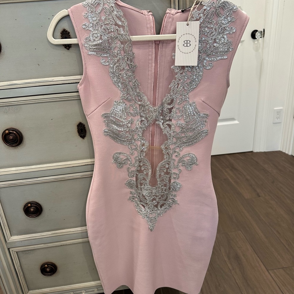 Brand New Bella Barnett Dress Pink bandage type. Size small I believe